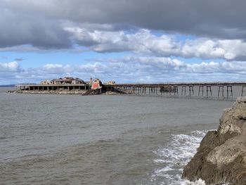 Bridge over sea against sky