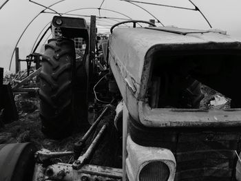 Abandoned car against sky