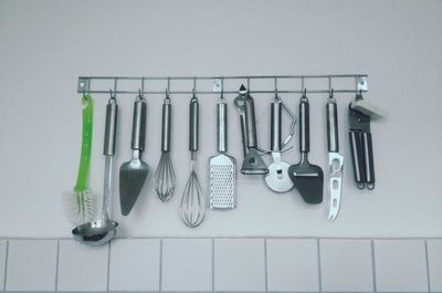 Assorted utensils hanging in a kitchen