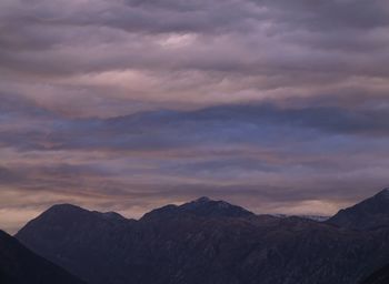 Scenic view of mountains against sky during sunset