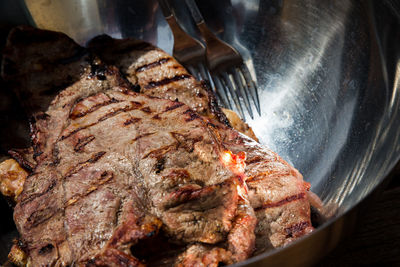 Close-up of meat on barbecue grill