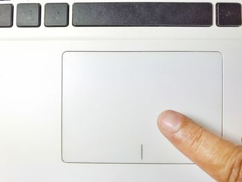 Close-up of human hand against white background