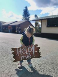 Girl with text on wall