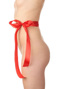 Midsection of woman standing against white background