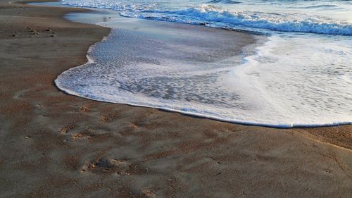 High angle view of waves on beach