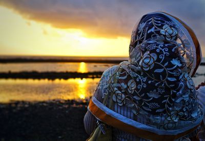 Close-up of mid adult man at beach against sky