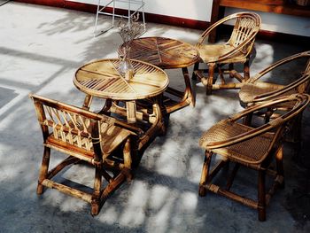 High angle view of empty chairs and table in cafe