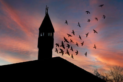 Low angle view of church against sky during sunset