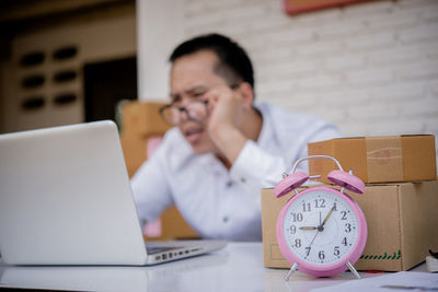 Man using mobile phone on table