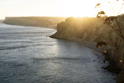 Scenic view of sea against clear sky during sunset