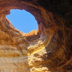 Low angle view of rock formations against sky