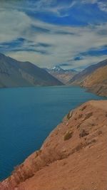 Scenic view of lake and mountains against sky