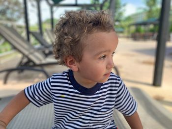 Cute boy looking away at playground