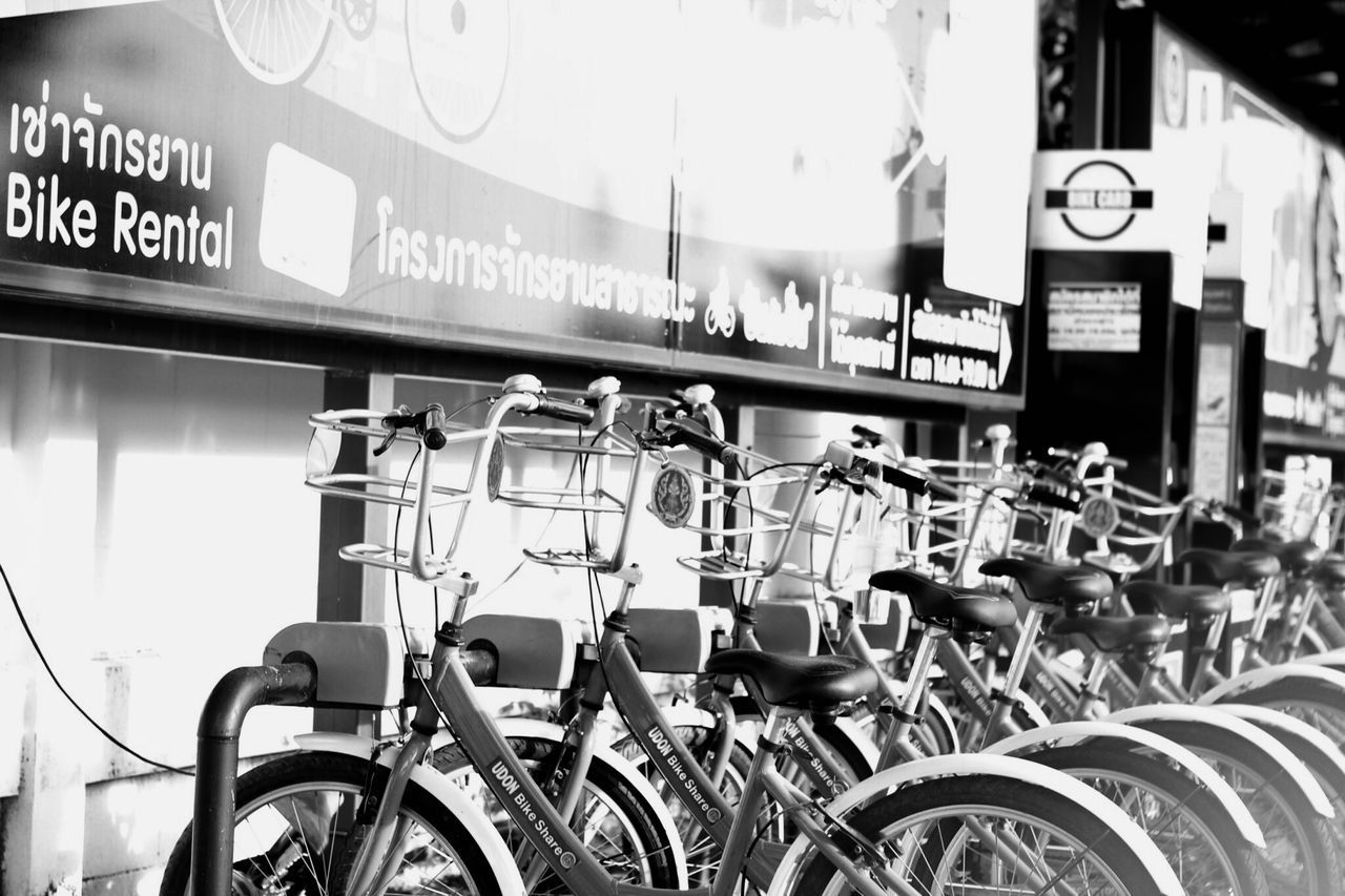 BICYCLES PARKED BY STREET