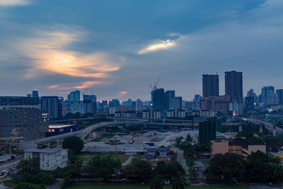 High angle view of buildings against sky during sunset