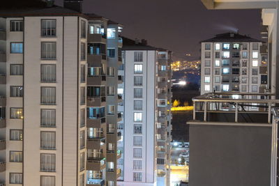 Illuminated buildings in city at night