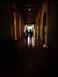 Full length of woman walking in tunnel