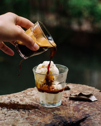 Close-up of hand holding drink