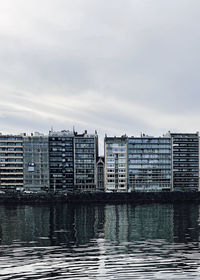 Buildings in city against sky