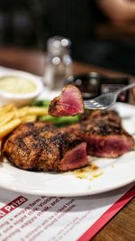 Close-up of meat served in plate on table