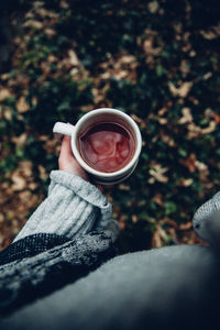 Close-up of hand holding tea cup