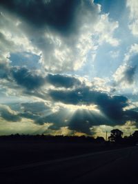 Scenic view of landscape against cloudy sky