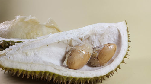 Close-up of cake on table against white background