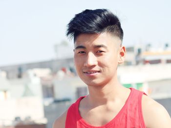 Close-up portrait of smiling young man