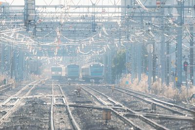 Railroad tracks in city during winter