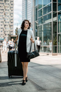 Full length of woman standing in city