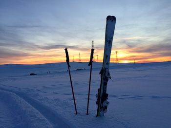 Scenic view of snow field against sky during sunset