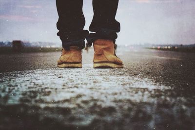 Low section of people walking on road