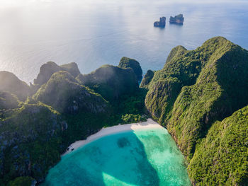 High angle view of rocks on sea shore