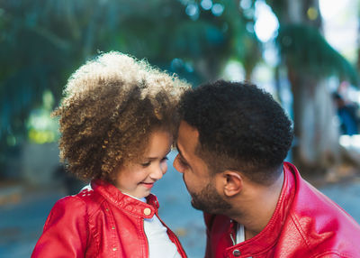 Portrait of couple kissing outdoors