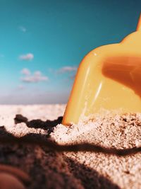 Close-up of ice cream on beach