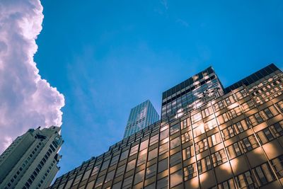 Low angle view of buildings against blue sky