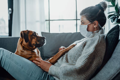 Woman with dog at home