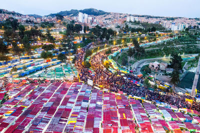 High angle view of illuminated cityscape against sky