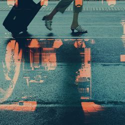 Low section of woman on zebra crossing