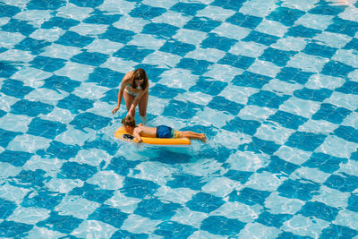 High angle view of man swimming in pool