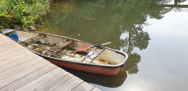 High angle view of boat in lake against trees