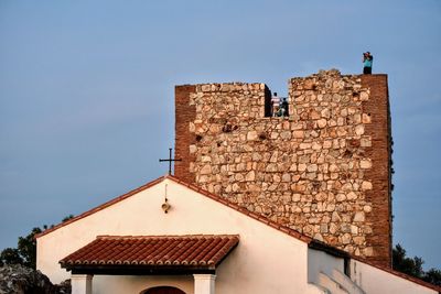 Low angle view of old building against clear sky