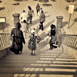 High angle view of people walking on steps