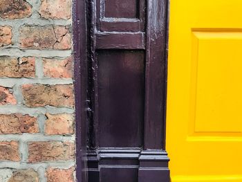 Closed door of yellow building