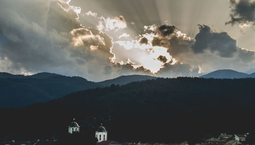 Scenic view of silhouette mountains against sky