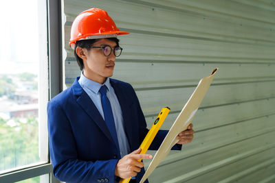 Portrait of engineer working at construction site