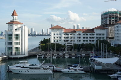 Boats moored at harbor