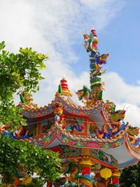 Multi colored built structure against blue sky