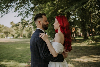 Wedding day. happy bride and groom hugging and laughing red hair diversity