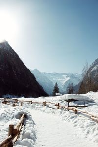 Scenic view of snow covered mountains against sky